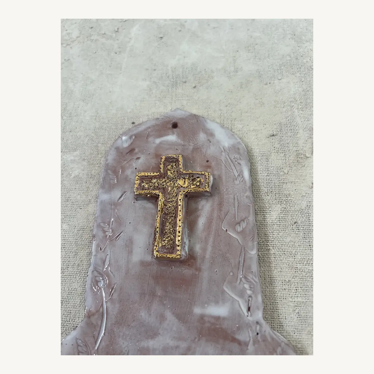 White and gold shell and cross holy water font